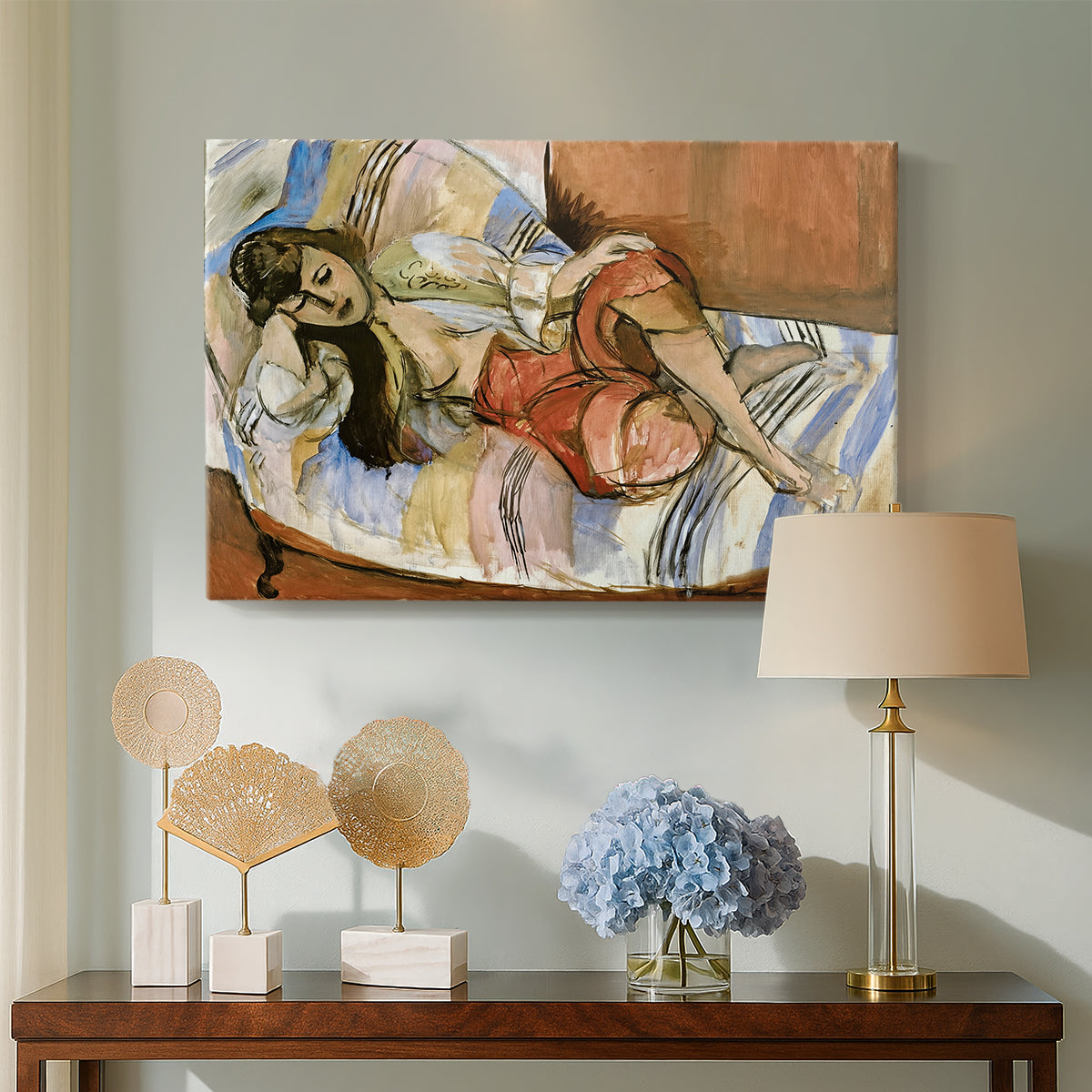 Canvas art print featuring a stylized reclining female figure in an ornate interior, displayed above a styled console table