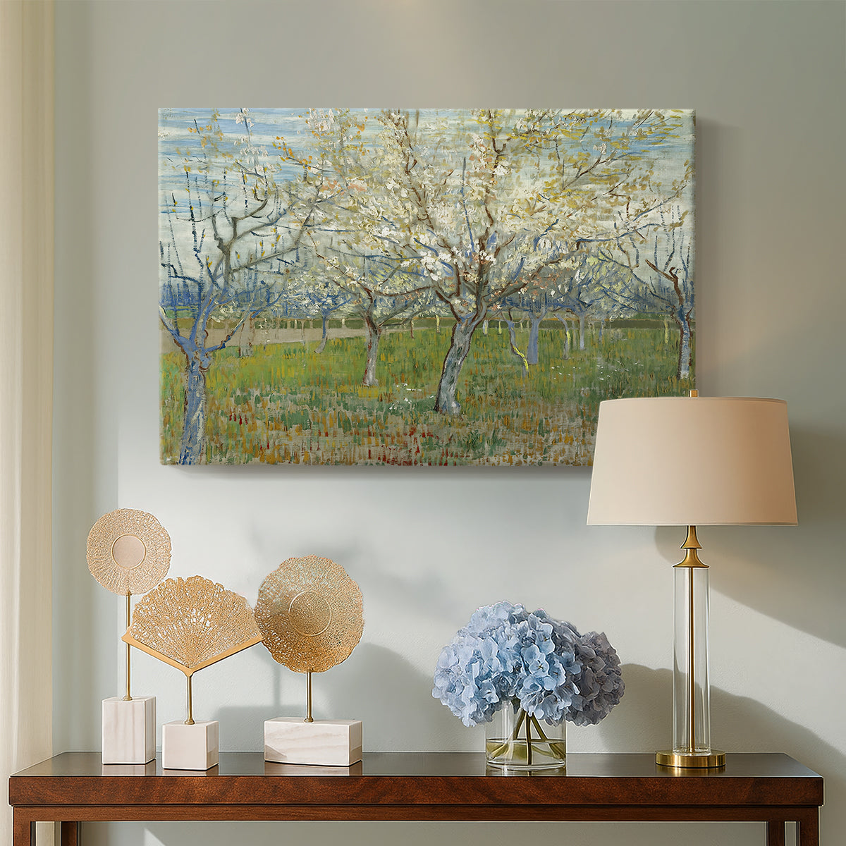 Canvas art print featuring a post-impressionist landscape emphasizing light and color, displayed above a styled console table
