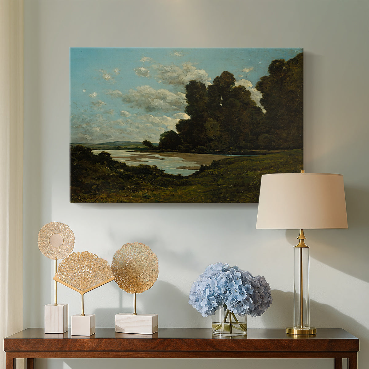 Canvas art print featuring a countryside waterway with town along horizon, displayed above a styled console table
