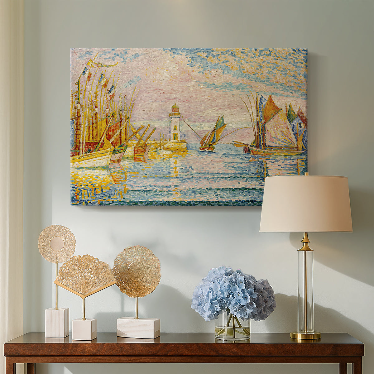 Canvas art print featuring a pointillist lighthouse view, displayed above a styled console table