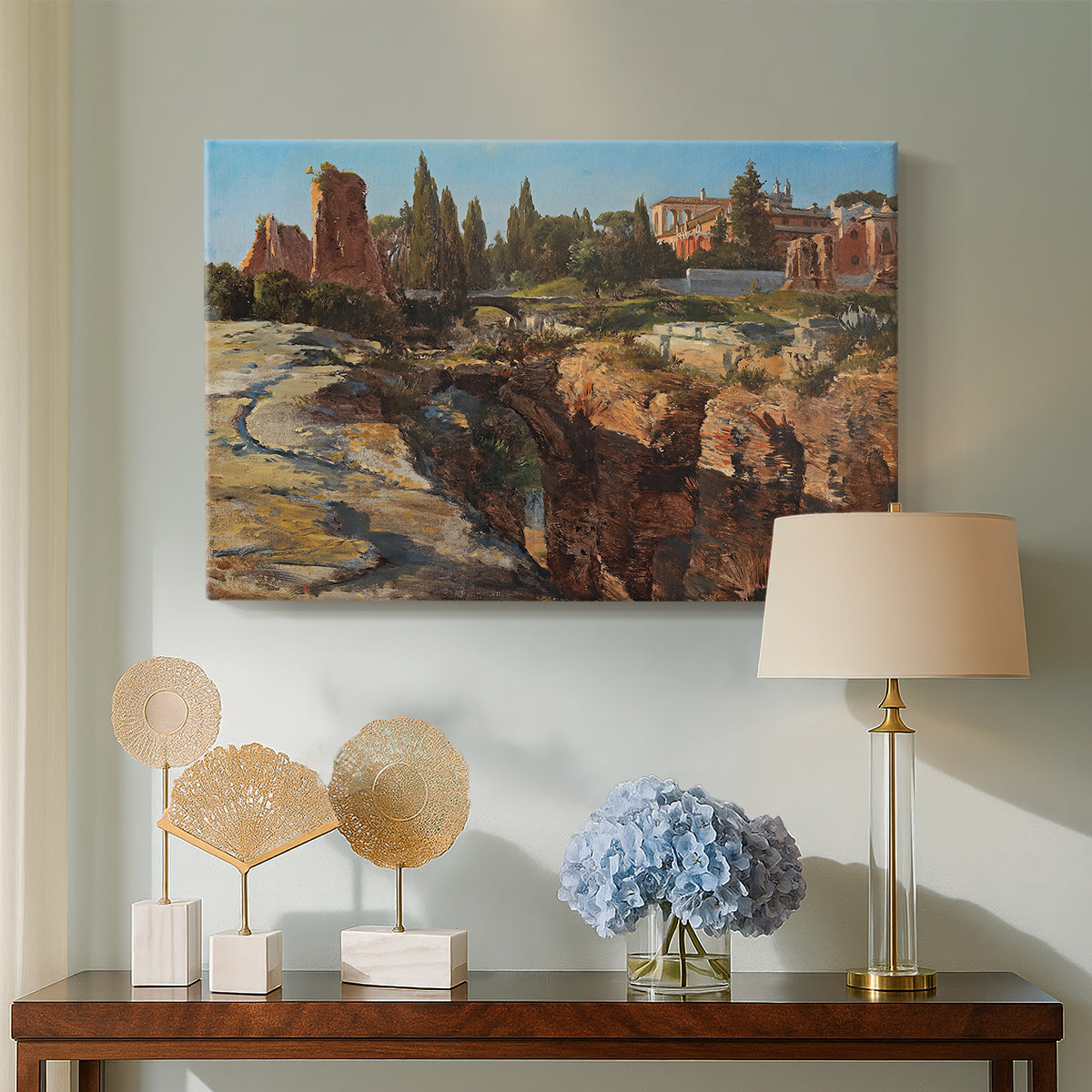 Canvas art print featuring a cityscape with classical ruins and surrounding terrain, displayed above a styled console table