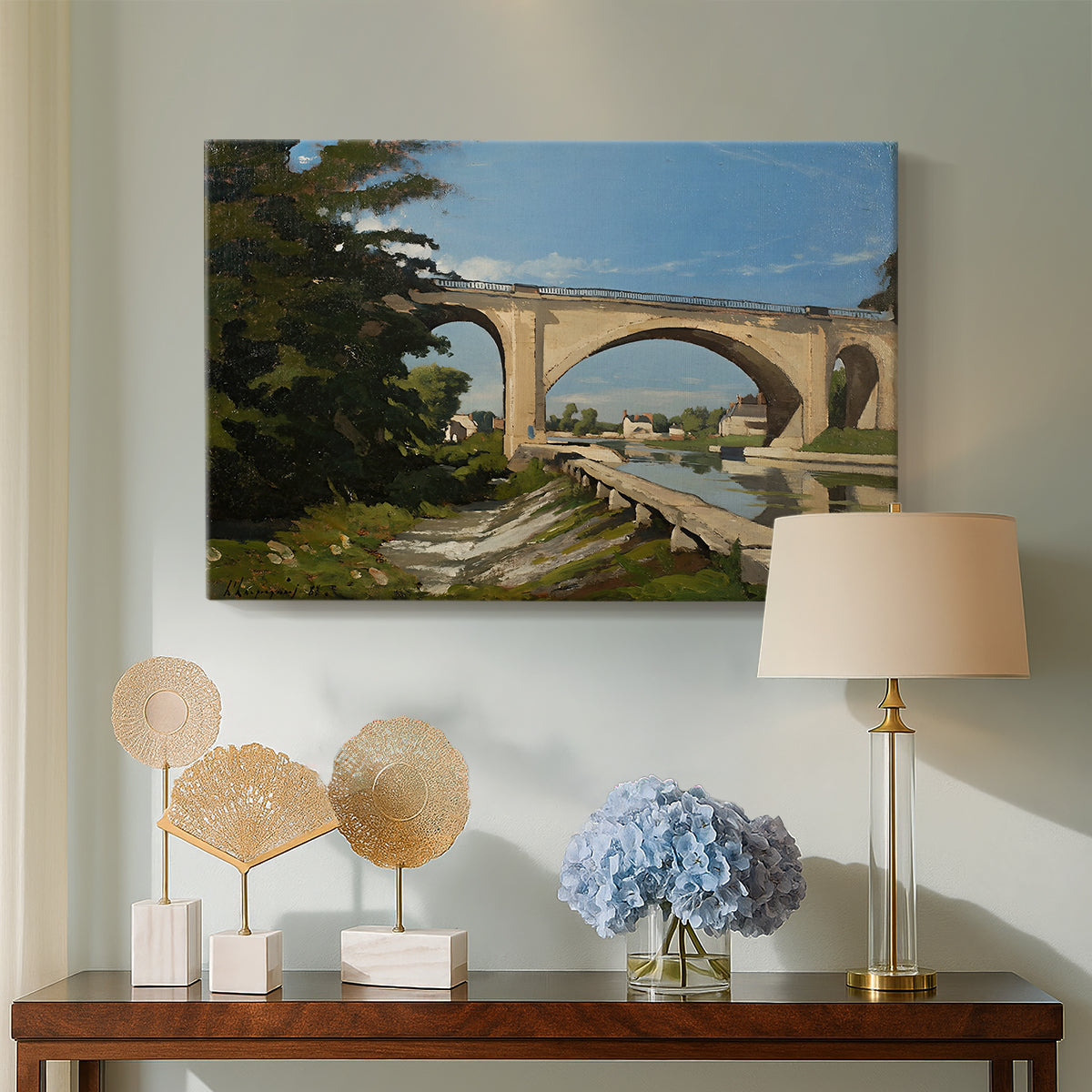 Canvas art print featuring a scenic view of bridge with water and surrounding environment, displayed above a styled console table