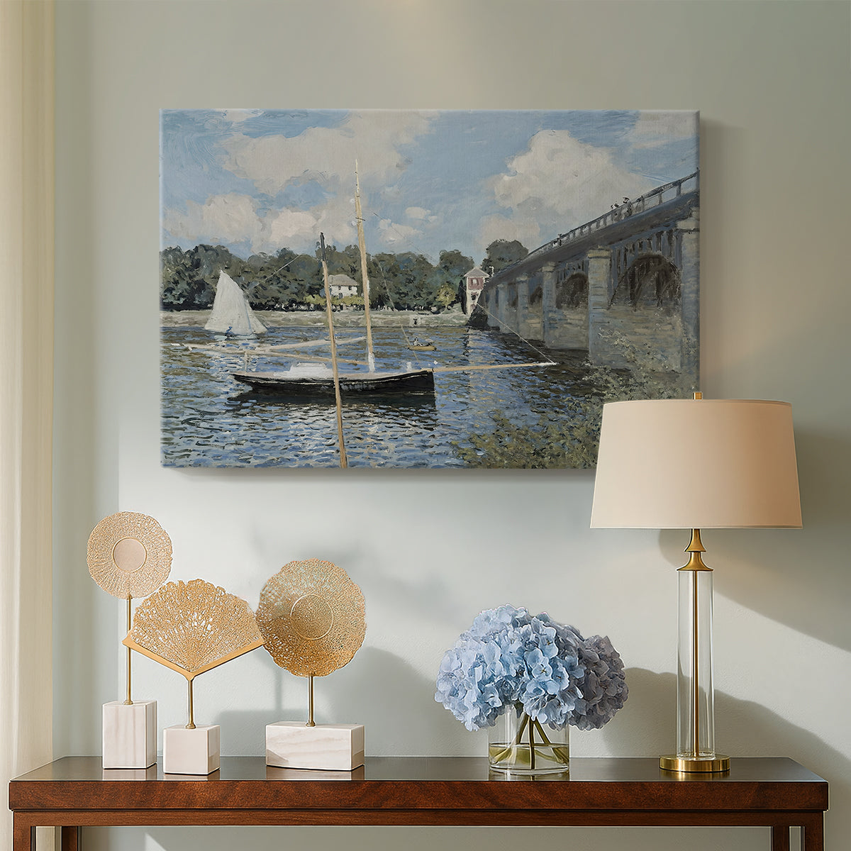 Canvas art print featuring a calm waterway with bridge structure and leisure boats, displayed above a styled console table