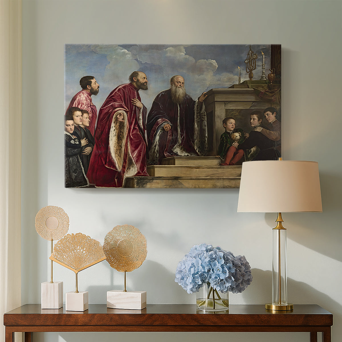 Canvas art print featuring a Renaissance family composition centered on ritual veneration, displayed above a styled console table