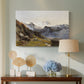 Canvas art print featuring an alpine vista with towering peak and foreground terrain, displayed above a styled console table