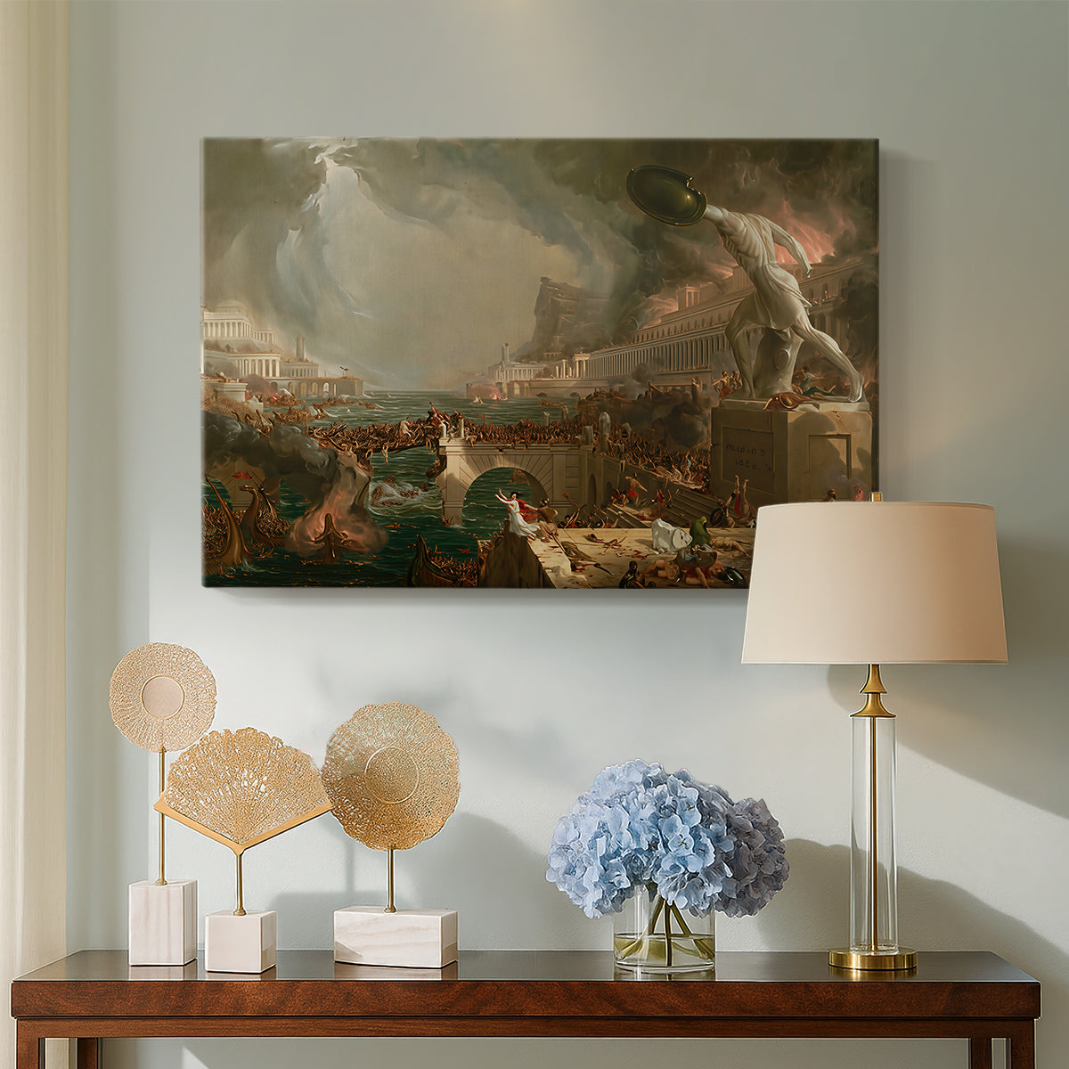 Canvas art print featuring an urban landscape in turmoil with figures fleeing and fighting, displayed above a styled console table