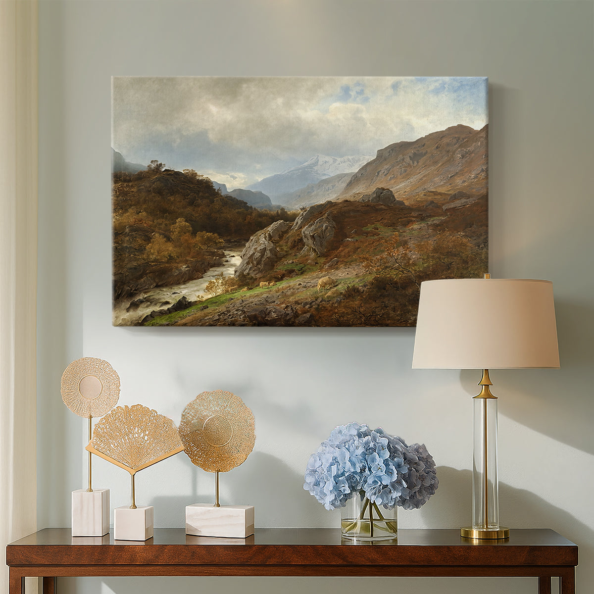 Canvas art print featuring a natural scene with elevation and layered mountains, displayed above a styled console table