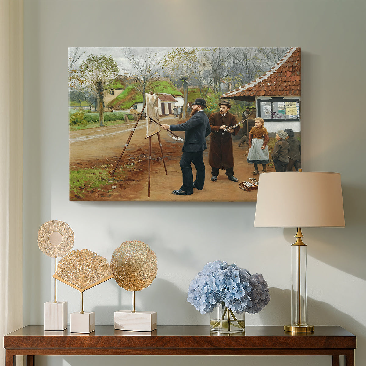 Canvas art print featuring a rustic village setting with people interacting in open space, displayed above a styled console table
