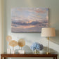 Canvas art print featuring an expressive sky scene with soft color transitions, displayed above a styled console table