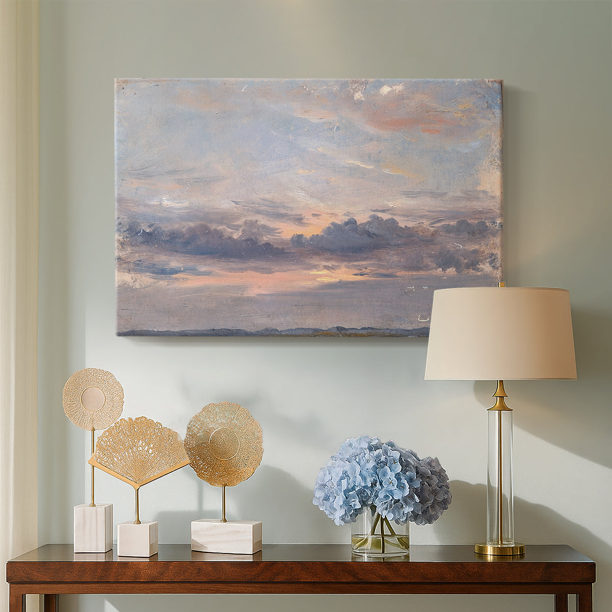 Canvas art print featuring an expressive sky scene with soft color transitions, displayed above a styled console table