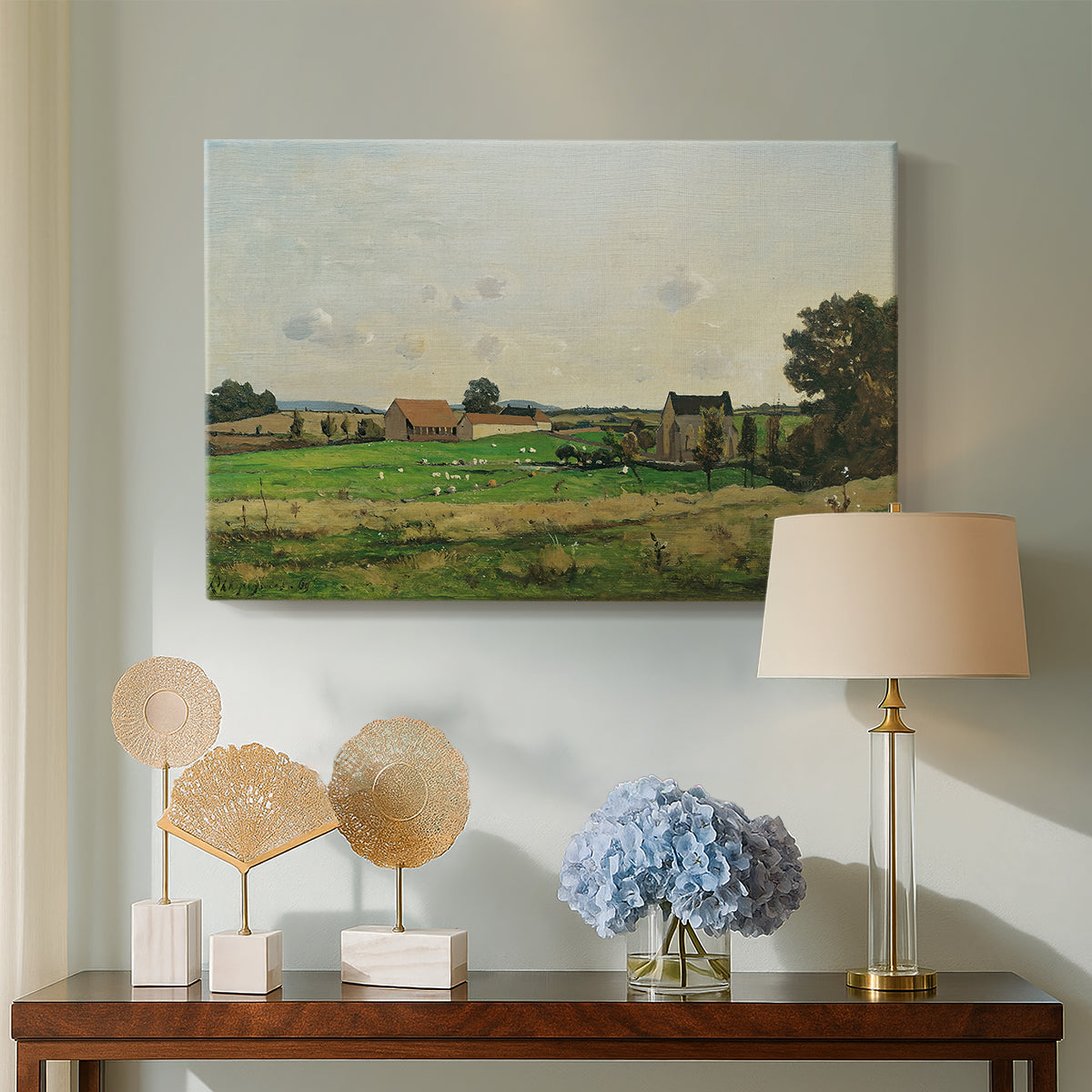 Canvas art print featuring a rural scene with estate and surrounding greenery, displayed above a styled console table