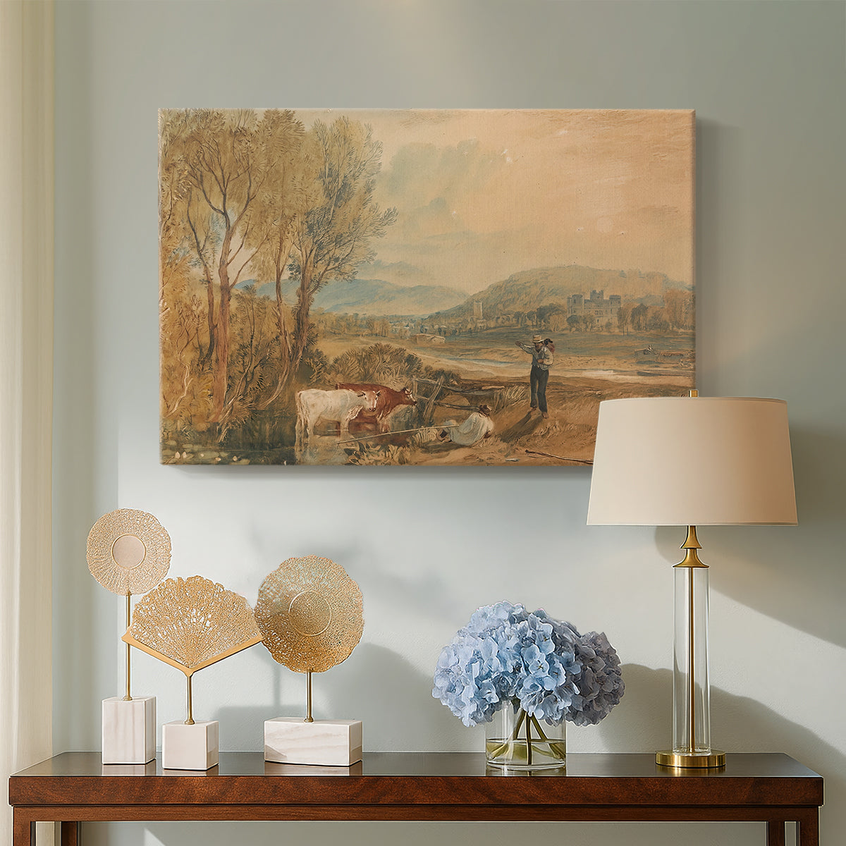 Canvas art print featuring an expressive countryside view with building, displayed above a styled console table