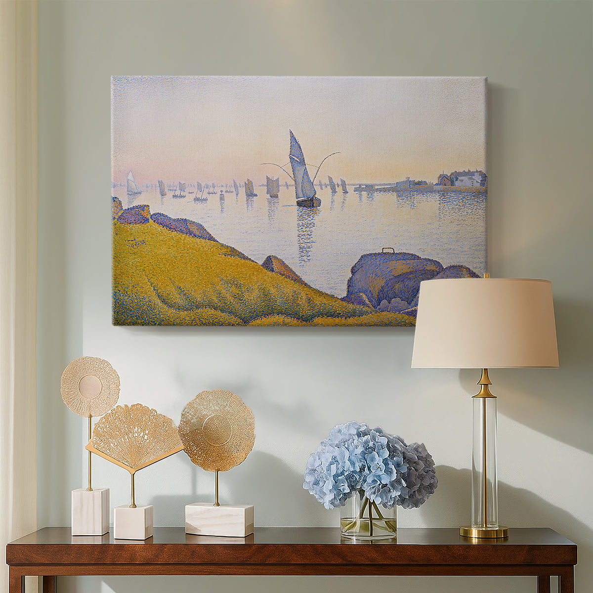 Canvas art print featuring a pointillist sunset harbor with calm sea, displayed above a styled console table