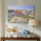 Canvas art print featuring a pointillist industrial view, displayed above a styled console table