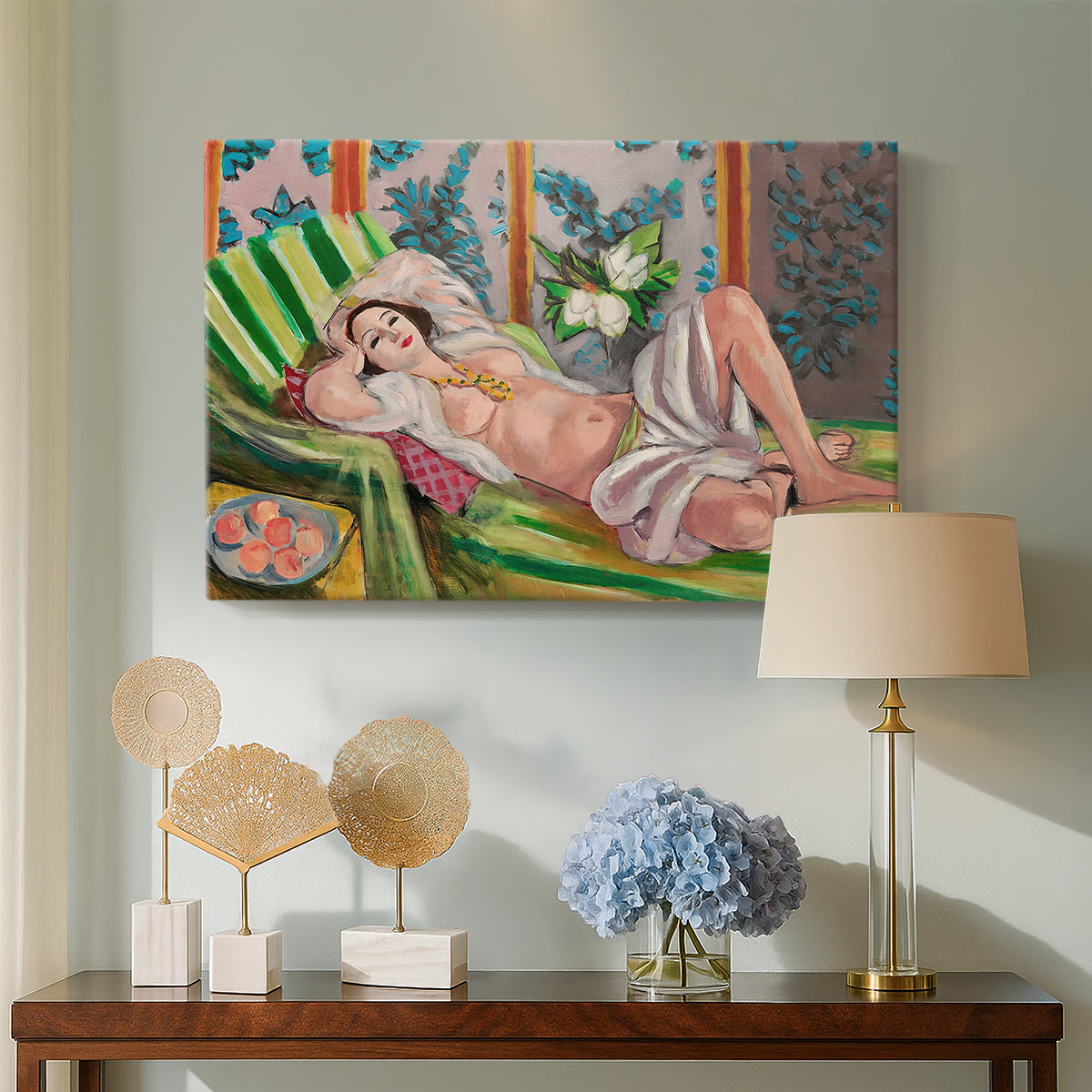 Canvas art print featuring an expressive reclining figure amid floral motifs, displayed above a styled console table