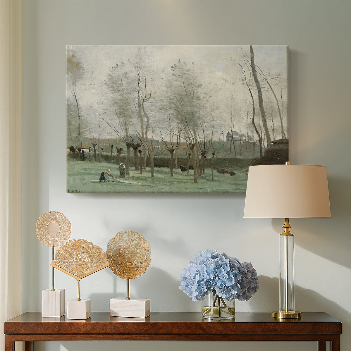 Canvas art print featuring a soft landscape with people and trees in calm setting, displayed above a styled console table