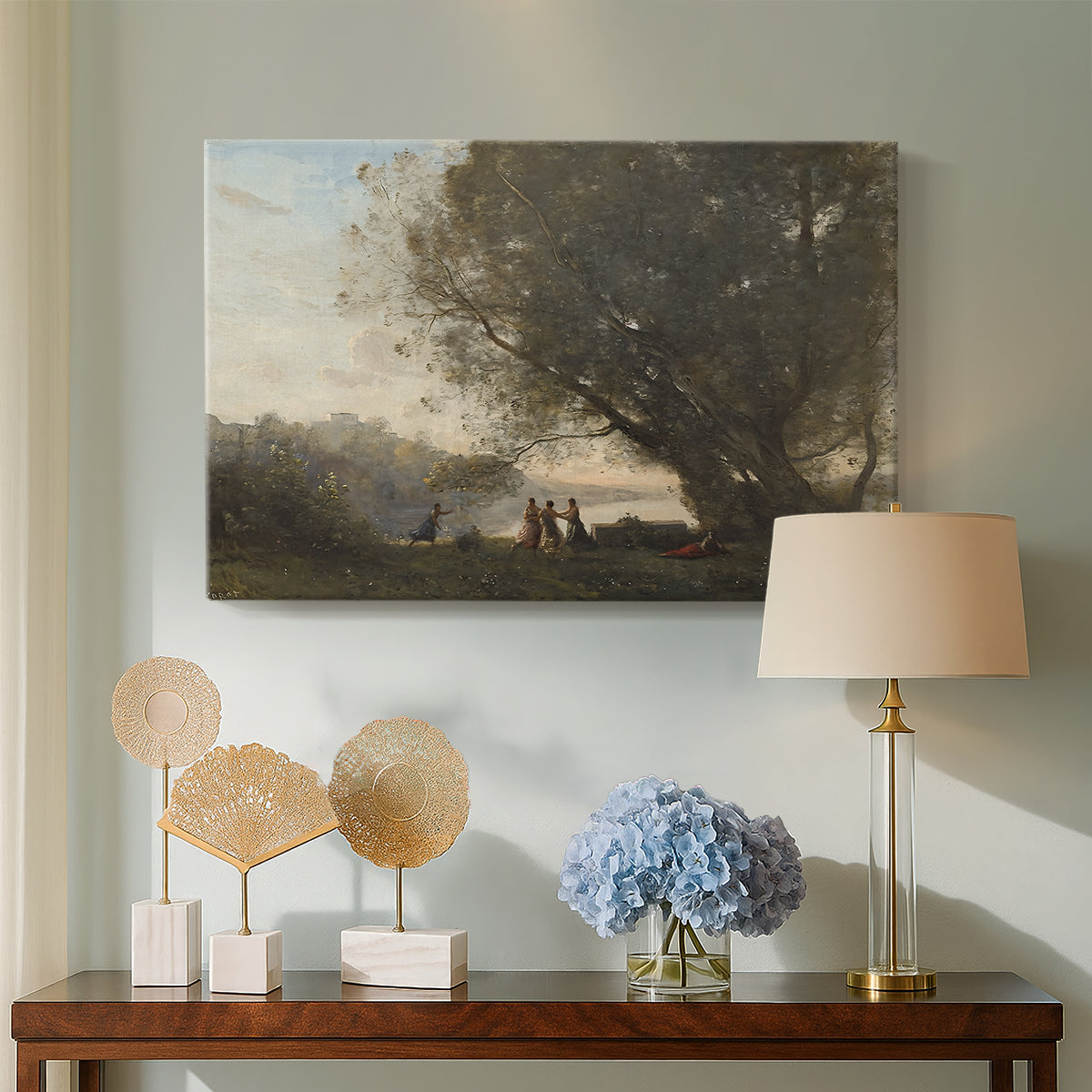 Canvas art print featuring a soft landscape combining figures and natural surroundings, displayed above a styled console table