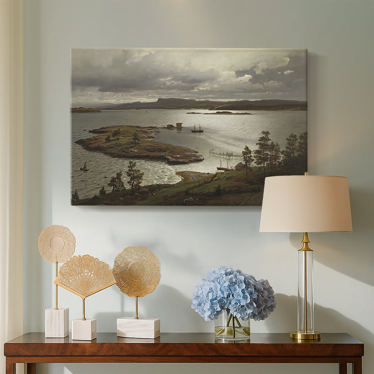 Canvas art print featuring an expansive waterway bordered by hills and sky, displayed above a styled console table