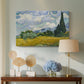 Canvas art print featuring a post-impressionist countryside scene with crops and sky, displayed above a styled console table
