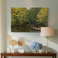Canvas art print featuring a rural landscape with boy focused on fishing activity, displayed above a styled console table