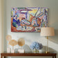 Canvas art print featuring an expressive composition of people resting near the sea, displayed above a styled console table
