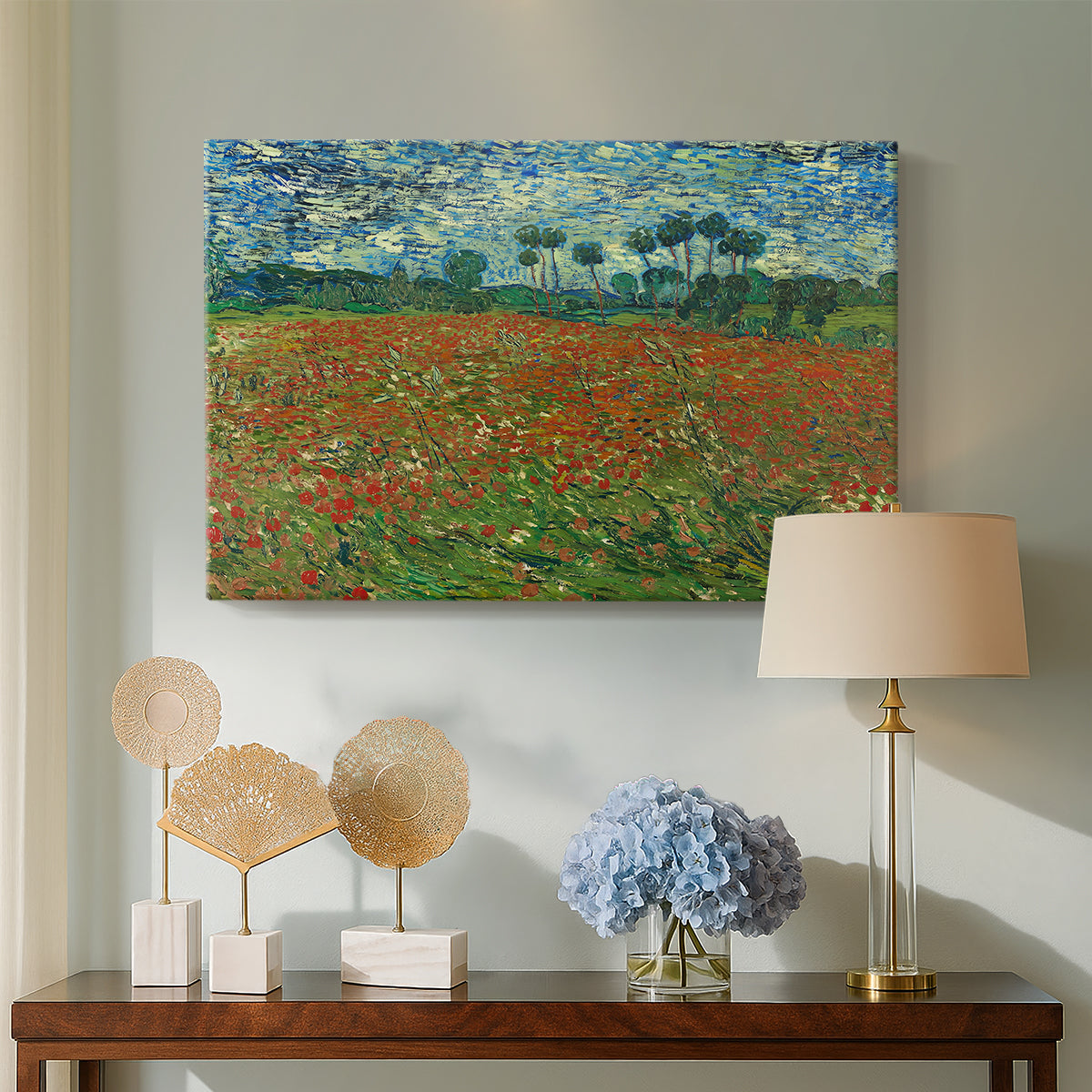 Canvas art print featuring a landscape emphasizing contrast between red blossoms and green field, displayed above a styled console table