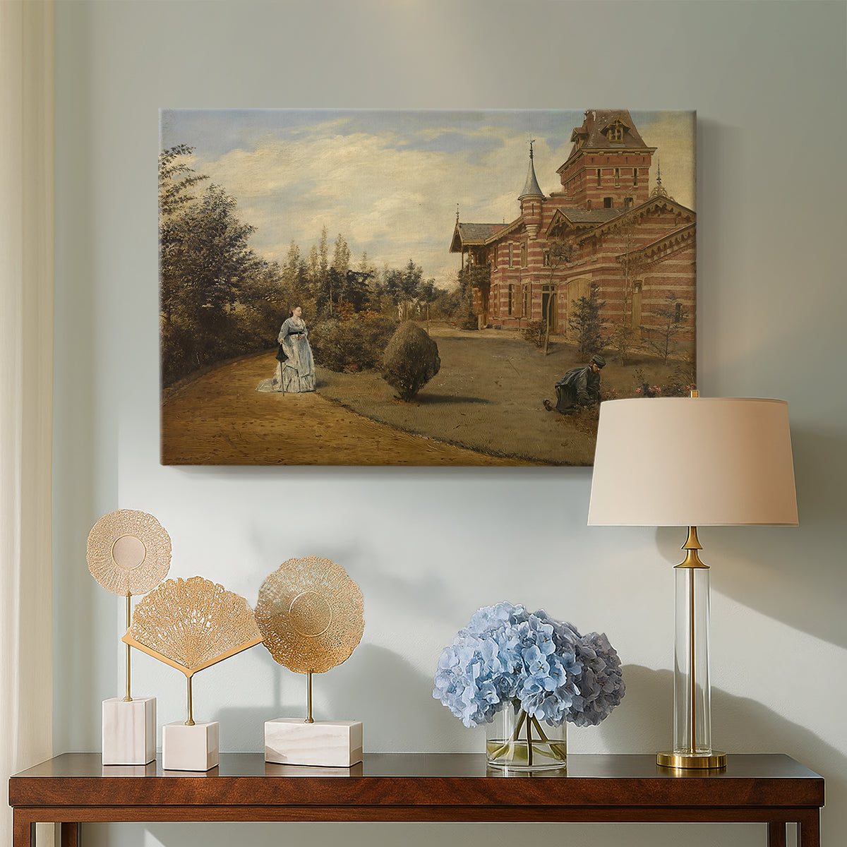 Canvas art print featuring an outdoor composition with house façade and nearby activity, displayed above a styled console table