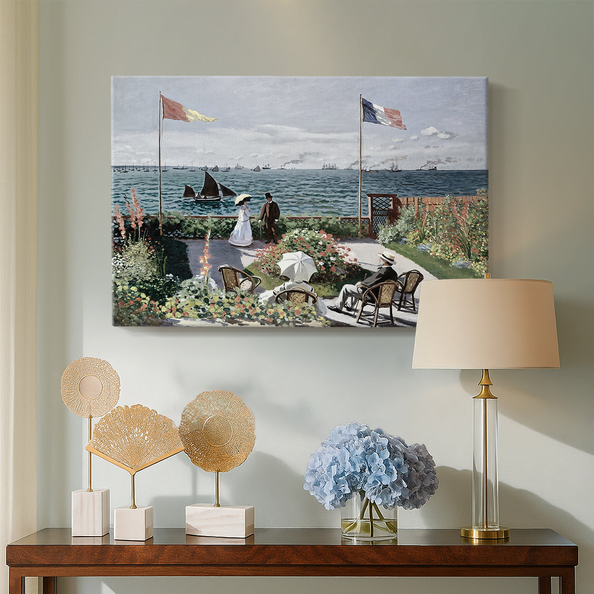 Canvas art print featuring a vibrant garden scene with colorful blooms and distant sea, displayed above a styled console table