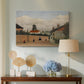 Canvas art print featuring a simplified urban landscape with architecture and sky, displayed above a styled console table