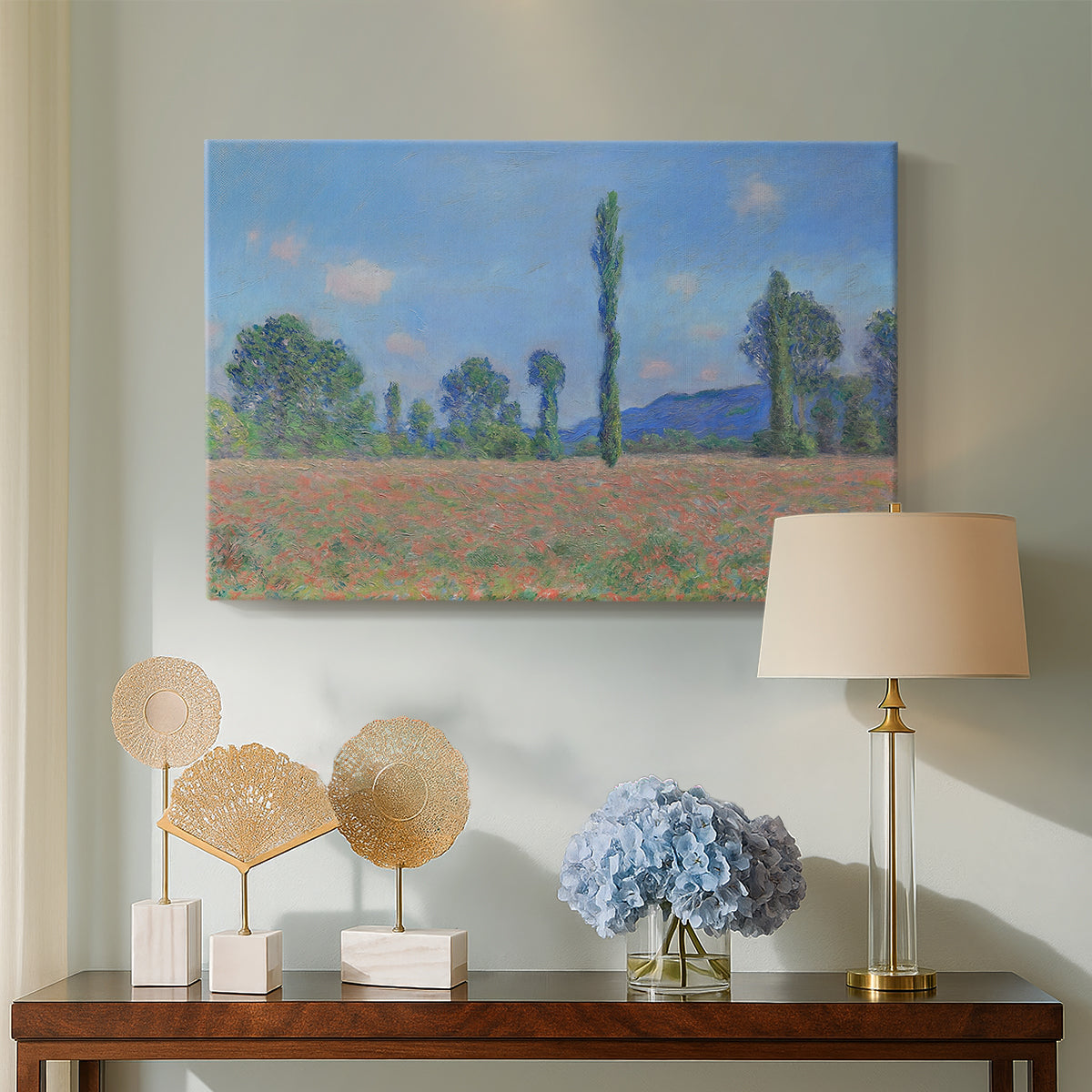Canvas art print featuring a vibrant meadow scene with flowers and vertical tree forms, displayed above a styled console table