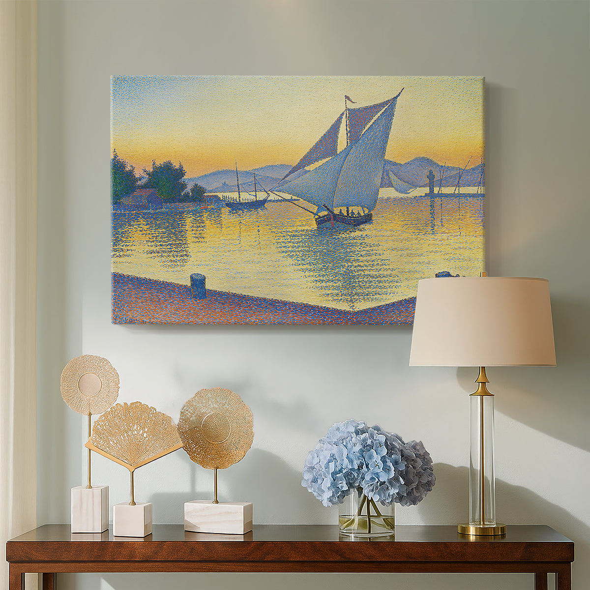Canvas art print featuring a pointillist sunset composition with sailboats , displayed above a styled console table