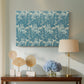 Canvas art print featuring a patterned composition with symmetrical botanical elements, displayed above a styled console table