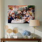 Canvas art print featuring an impressionist scene of friends enjoying lunch with wine and conversation, displayed above a styled console table