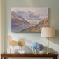 Canvas art print featuring a realistic depiction of high-altitude snowy peaks, displayed above a styled console table
