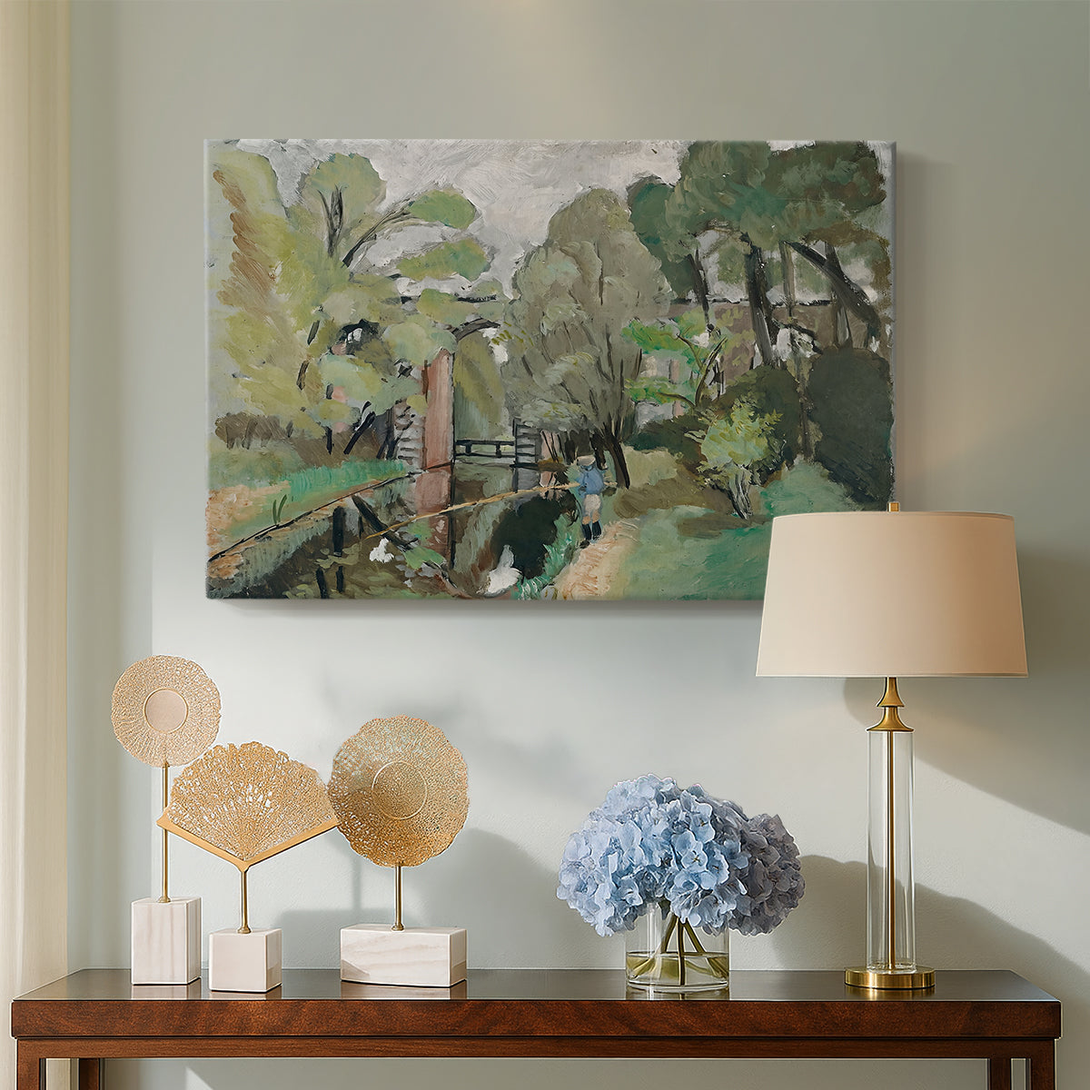Canvas art print featuring a stylized landscape with a fisherman in nature, displayed above a styled console table