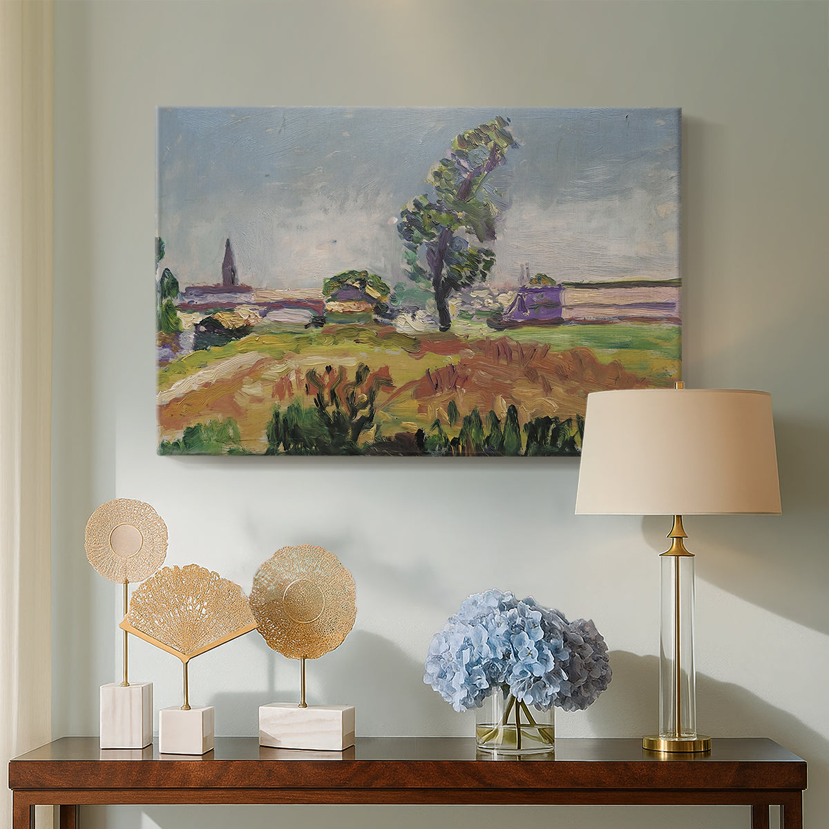 Canvas art print featuring a landscape with a river crossing and soft vegetation, displayed above a styled console table