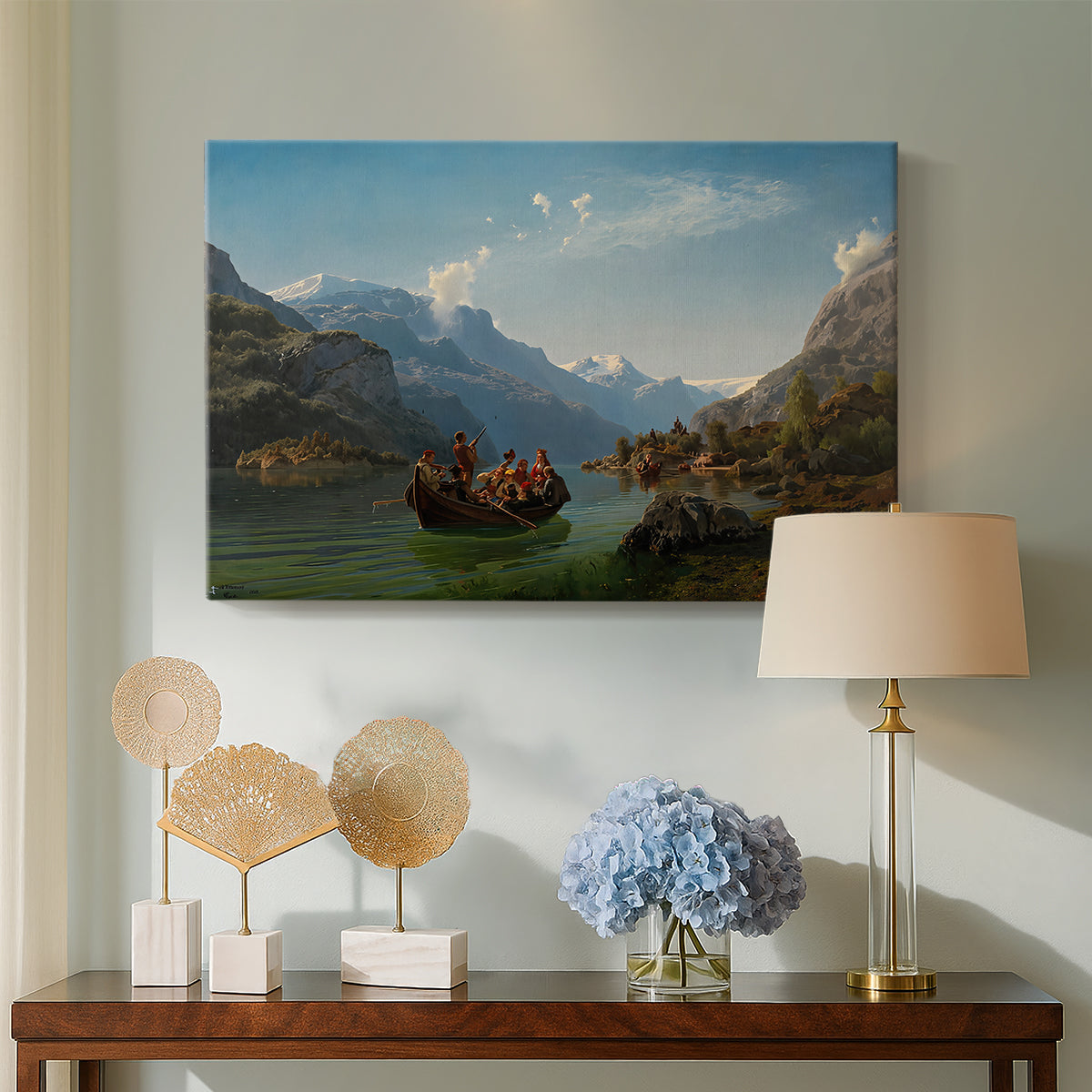 Canvas art print featuring a scenic fjord landscape with figures in boats celebrating a bridal procession, displayed above a styled console table