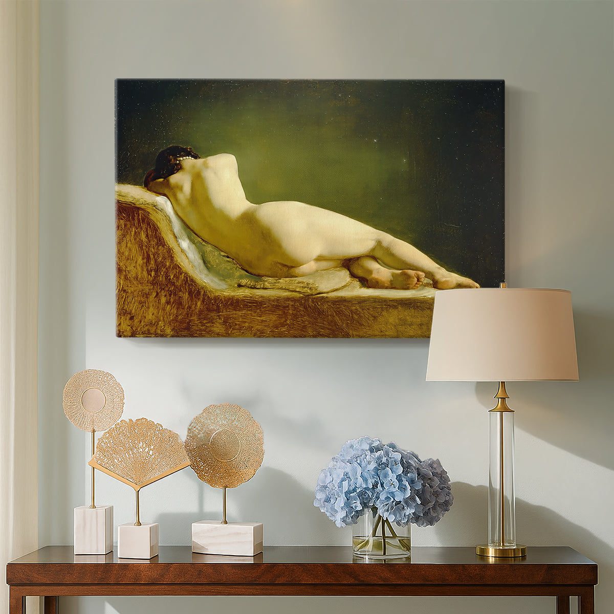 Canvas art print featuring a figure study of reclining body with soft lighting, displayed above a styled console table