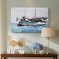 Canvas art print featuring a composition showing exchange of goods between boats, displayed above a styled console table
