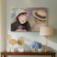 Canvas art print featuring an impressionist depiction of couple enjoying leisure time near water, displayed above a styled console table