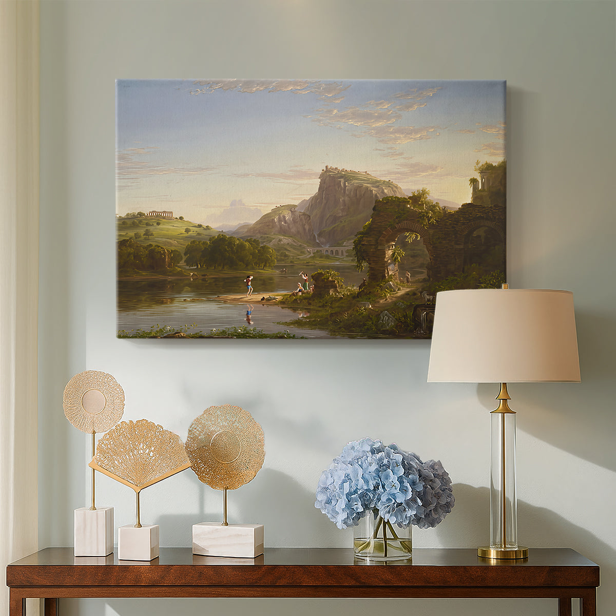 Canvas art print featuring a landscape combining architecture, figures, and open terrain, displayed above a styled console table