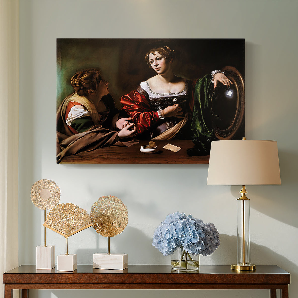 Canvas art print featuring an intimate interaction between two women with mirror and objects, displayed above a styled console table