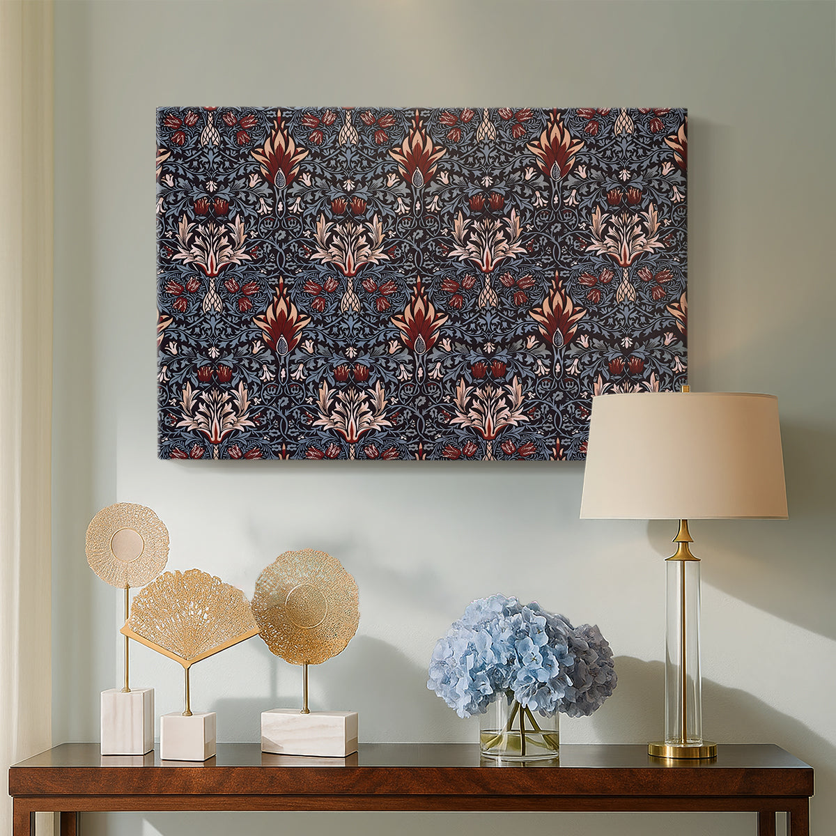 Canvas art print featuring a textile pattern with alternating blossoms and leaves, displayed above a styled console table