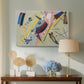Canvas art print featuring an abstract arrangement combining linear elements and color accents, displayed above a styled console table