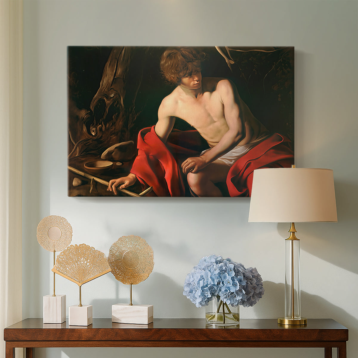 Canvas art print featuring a biblical youth seated outdoors with symbolic staff and minimal landscape, displayed above a styled console table