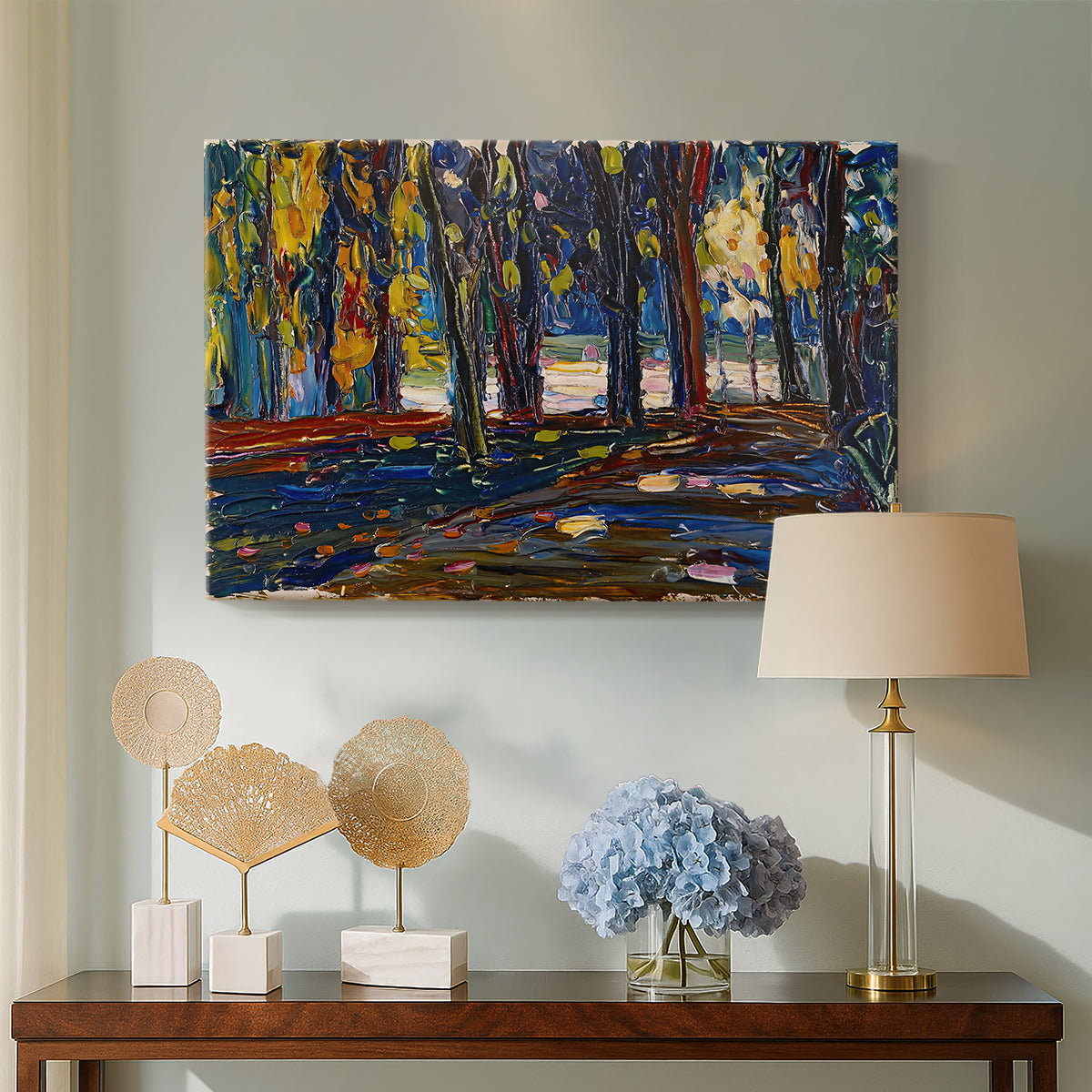 Canvas art print featuring a semi-abstract composition with trees and layered brushwork, displayed above a styled console table