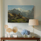 Canvas art print featuring a coastal landscape with calm water and mountainous backdrop, displayed above a styled console table