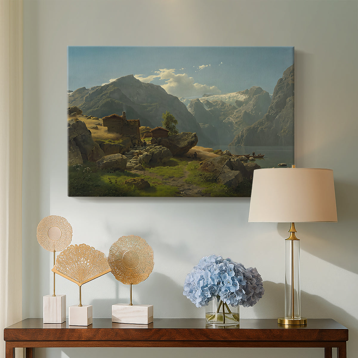 Canvas art print featuring a coastal landscape with calm water and mountainous backdrop, displayed above a styled console table