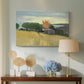 Canvas art print featuring a bright countryside scene with field and soft sky, displayed above a styled console table