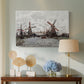 Canvas art print featuring a countryside scene with traditional windmills and reflections, displayed above a styled console table